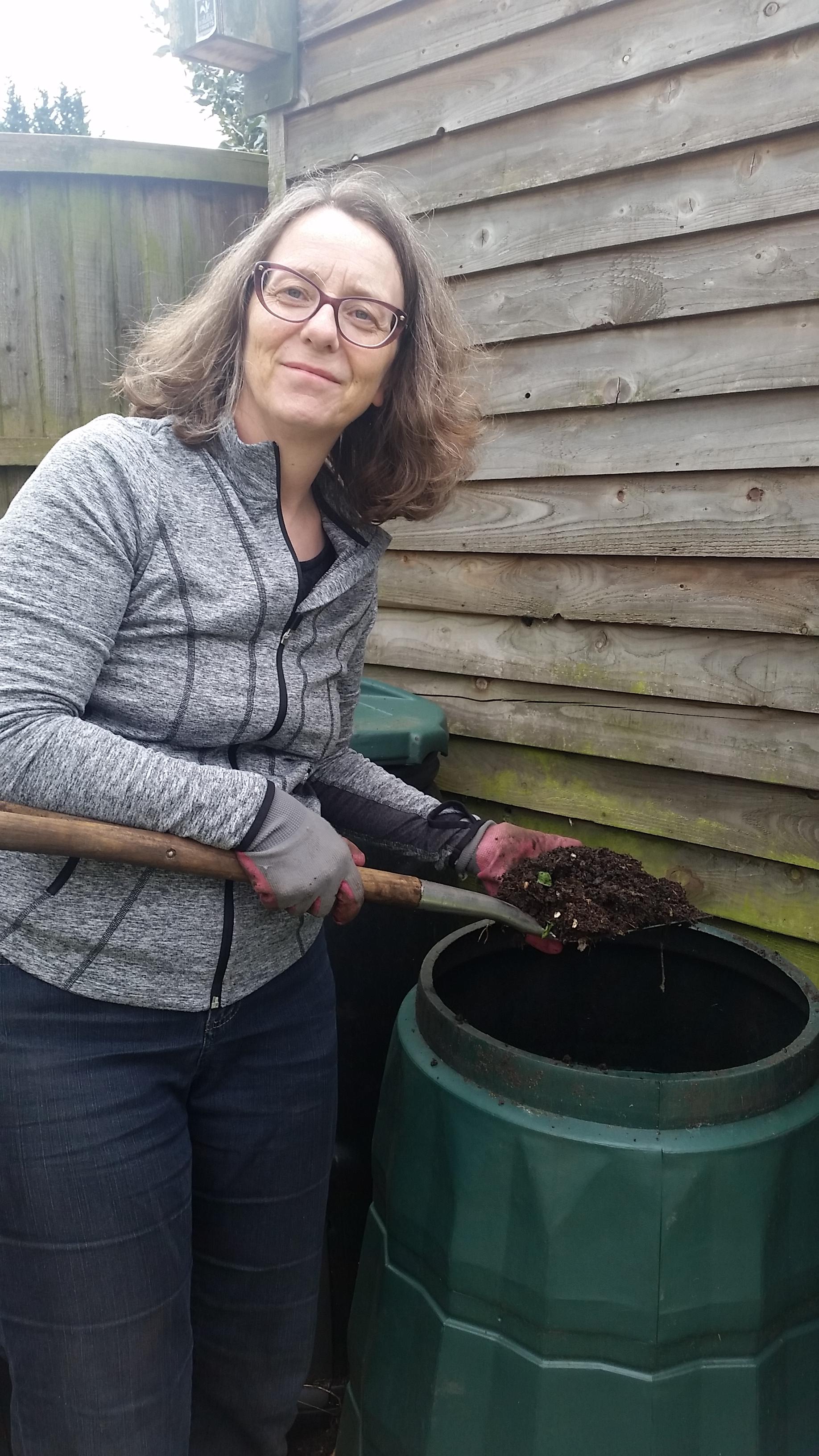 Mrs Brown emptying her compost bin.